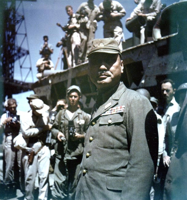 Vice Admiral Michitoro Tozuka immediately after formally surrendering the Yokosuka Naval Base to US Navy Rear Admiral Robert B. Carney, Yokosuka, Japan, 30 Aug 1945