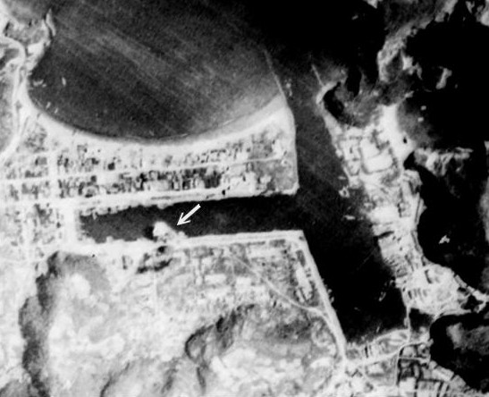 Harbor under attack by a PB4Y-1 aircraft of US Navy VPB-104 squadron, Suo, Taihoku Prefecture (now Su'ao, Yilan County), Taiwan, 24 Jun 1945, photo 2 of 3