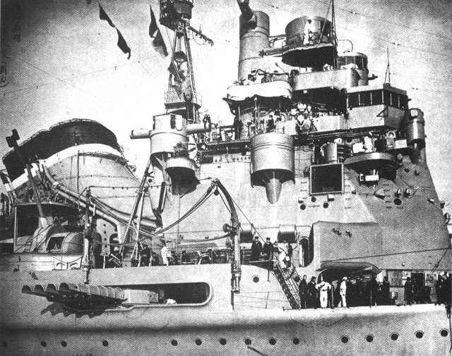 Japanese cruiser Takao with her forward torpedo tubes swung out, circa 1943. These tubes were meant to launch the 3-ton Type 93 torpedo.