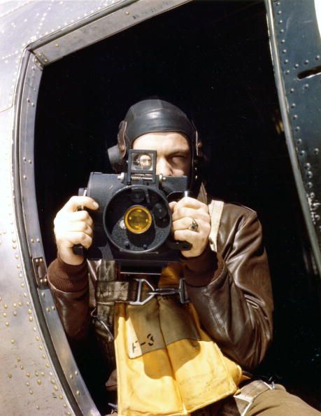 Staff Sergeant Brush posing with his Fairchild K-20 aerial camera, circa 1944.