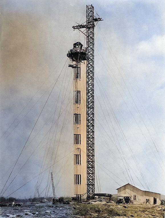 The 100-ft mooring mast on the Ewa Plain, Oahu, Hawaii during construction, 1925. [Colorized by WW2DB]