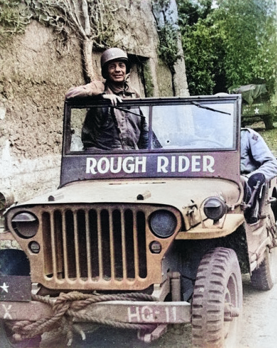 Brigadier General Theodore Roosevelt, Jr. in his Jeep 'Rough Rider' near the front lines in Normandy, Jun 1944. [Colorized by WW2DB]