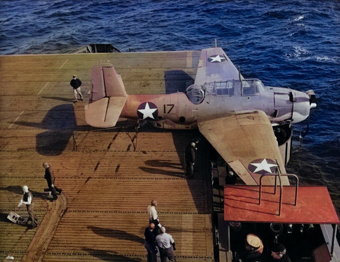 TBF-1 Avenger landing on Auxiliary Carrier USS Card bounced over the arresting cables, crashed the barrier, and stopped in an anti-aircraft gun tub, 9 Dec 1942 off San Diego, California, United States. 2 of 2. [Colorized by WW2DB]
