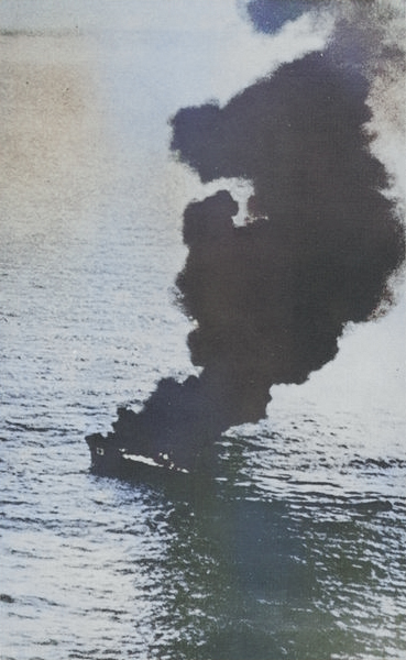 Japanese Navy auxiliary picket boat Nitto Maru No. 23 burning, 18 Apr 1942 [Colorized by WW2DB]