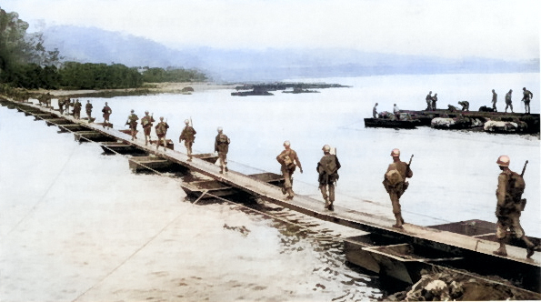 US Army soldiers crossing the Machinato Inlet on foot bridge, Okinawa, Japan, morning of 19 Apr 1945 [Colorized by WW2DB]
