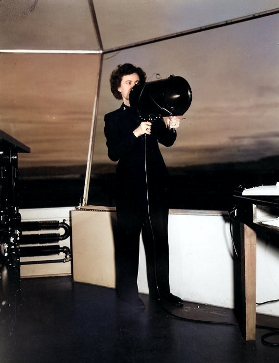 WAVES Specialist (Y) 3rd Class Doris M. Rolph signaling aircraft with a control tower signal lamp, Naval Air Station, Moffett Field, California, United States, circa 1944-1945 [Colorized by WW2DB]