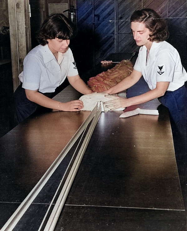 WAVES Parachute Riggers 3rd Class Pearl L. Pittelkow and Virginia Sibbald repacking a parachute, Naval Air Station, Memphis, Tennessee, United States, circa 1943, photo 2 of 2 [Colorized by WW2DB]