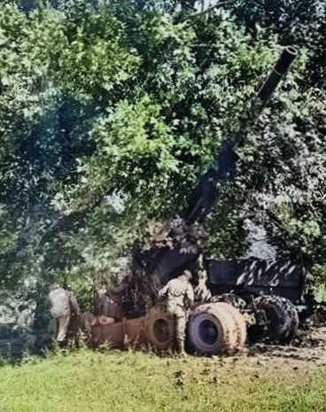 155mm Gun M1 being hidden beneath a large tree during exercise in Tennessee, United States, circa 1942 [Colorized by WW2DB]