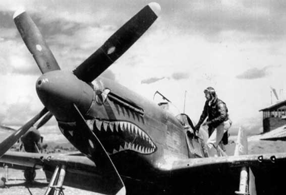 Colonel David 'Tex' Hill of 26th Fighter Squadron of USAAF 51st Fighter Group getting into his P-51 Mustang, China, 1940s, photo 1 of 2
