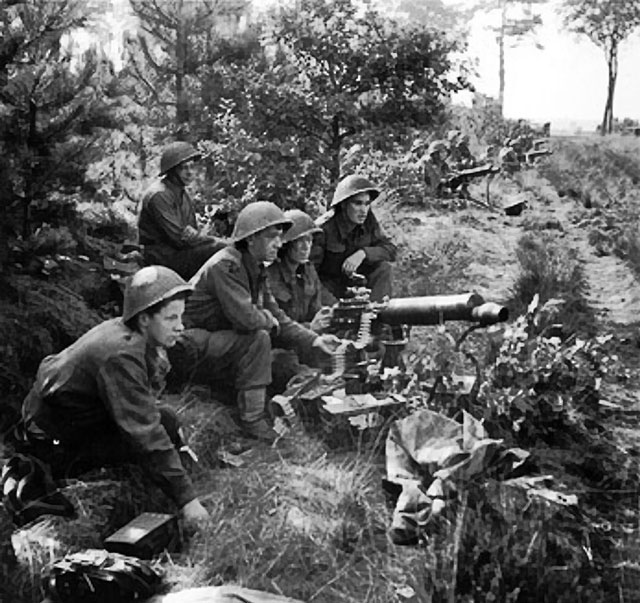 Vickers machine guns of 2nd Middlesex Regiment, British 3rd Division firing in support of troops crossing the Meuse-Escaut (Maas-Schelde) Canal at Lille-St. Hubert, Belgium, 20 Sep 1944