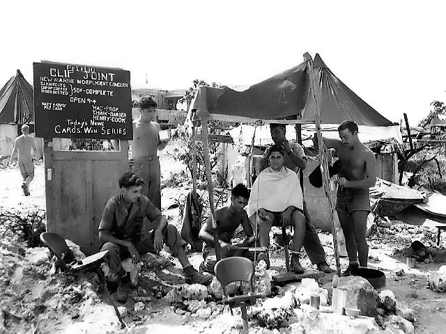 A barber shop set up by an American Marine on Peleliu, Palau Islands, 11 Oct 1944