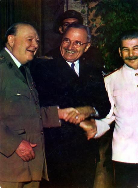 Churchill, Truman, and Stalin shaking hands during the Potsdam Conference, 