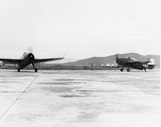 Two TBM-3 aircraft of US Navy squadron VT-26 (USS Santee) at Matsuyama Airfield, Taihoku (now Taipei), Taiwan, early Sep 1945