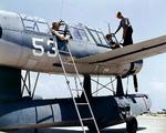 OS2U Kingfisher being tended to at a seaplane base, 1942-43; location unknown.