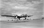 Early model Boeing B-17 Fortress taking off from Hickam Field, Oahu, Territory of Hawaii, pre-war, Aug 1941.