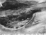 Strike photo stitched together from photos taken by USS Langley aircraft showing severe damage to the runway and the surrounding areas on Engebi Island (now Enjebi), Eniwetok Atoll, Marshall Islands, 11 Feb 1944.