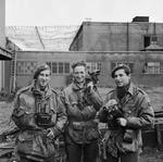 British Army photographers Sergeant Dennis M. Smith, Sergeant G. Walker, and Sergeant C. M. Lewis at Pinewood Studios, Iver Heath, Buckinghamshire, England, United Kingdom, late Sep 1944