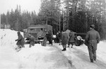 CMP Field Artillery Tractor with gun in tow after suffering a mishap on an icy snow covered road, British Columbia, Canada, 1943-45.