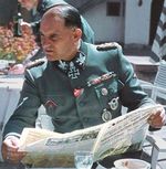 Josef Dietrich reading a newspaper, date unknown
