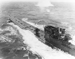 German Type IX submarine U-848 under attack by four US Navy PB4Y Liberators of VB-107 and two US Army B-25 Mitchells in the mid-Atlantic Ocean, 5 Nov 1943. U-848 was sunk in this attack with all 63 men lost.