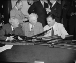 Morris Sheppard, George Lynch, and A. B. Chandler inspecting Johnson M1941 rifles, Washington, DC, United States, 29 May 1940