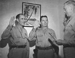Brigadier General Clarence Tinker and Colonel Willis Hale being sworn into their new, next higher ranks by Colonel Cheney Bertholf, Adjutant General of the 7th Air Force, Hickam Field, 21 Jan 1942.