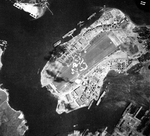 Aerial view straight down onto Ford Island, Pearl Harbor, Oahu, Hawaii, 18 Aug 1943.