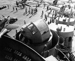 Mk 40 gun director seen from the island’s number two quad 40mm gun mount aboard the carrier USS Essex, late 1943. Note SBD Dauntless scout bombers with Bombing Squadron VB-9.