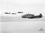Four Beaufort bombers of No. 100 Squadron RAAF in flight near Wewak, New Guinea, 20 Jan 1945