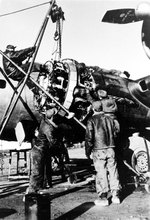 Aircraft mechanics of the USAAF 398th Bombardment Group change a B-17 engine, Nuthampstead, England, United Kingdom, May 1944 to Apr 1945