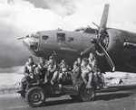 Air crew posing on Jeep in front of B-17F 