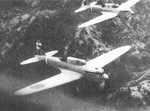 Two Ki-32 aircraft in flight over hilly terrain, circa 1940s