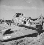 A wrecked German Bf 109 fighter, El Aouiana airfield, Tunisia, circa May-Jun 1943