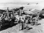 Australian troops with captured Morane-Saulnier MS.406 fighters and a Potez 630 bomber, Syria, Jul 1941