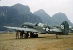 P-40N Warhawk fighters of the 74th Fighter Squadron (direct descendent of the AVG Flying Tigers) in China, probably Kweilin (now Guilin) 1943-44. Note rocket tubes being mounted under the wing.