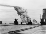Smoke rising from ammunition ship Mary Luckenbach of Allied convoy PQ-18, 13 Sep 1942; seen from flight deck of carrier, possibly HMS Avenger
