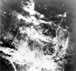Aerial view of Tokyo following bombing by B-29 Superfortress bombers, night of 26 May 1945