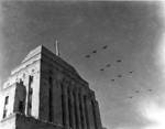 Military aircraft flying over Hong Kong during the victory celebration, 30 Aug 1945; photo taken by HMCS Ontario Leading Photographer Sydney H. Draper