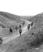 American troops marching through the Kasserine Pass, Tunisia, 26 Feb 1943