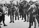 Japanese troops guarding prisoners from the British Suffolk Regiment, Singapore, Feb 1942