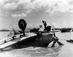 Wreck of D3A Type 99 carrier dive bomber at Agat beachhead, Guam, Mariana Islands, possibly shot down by naval gunfire during or after the landings; photo taken on 28 Jul 1944