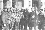 Japanese soldiers with a Chinese child, Nanjing, China, 19 Dec 1937