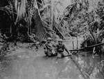 US Signal Corps cameramen Carl Weinke and Ernest Marjoram in New Guinea stream, 22 Apr 1944