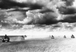 Type 89 tanks advancing across a grassy field, Mongolia Area, China, 1939