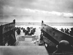 A LCVP from the U.S. Coast Guard-manned USS Samuel Chase disembarked troops on a Normandy beach, 6 Jun 1944