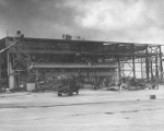 Wrecked hangar building and two damaged OS2U aircraft, Naval Air Station Ford Island, Oahu, US Territory, 8 Dec 1941