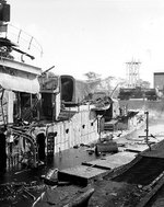 Starboard view of destroyer Downes, burned out and sunk in Pearl Harbor Navy Yard