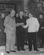 Churchill, Truman, and Stalin shaking hands during the Potsdam Conference, Germany, 23 Jul 1945, photo 2 of 3