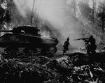 American troops advanced under the cover of M4 Sherman tank 