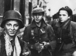 Young Polish resistance fighters Tadeusz Rajszczak (left), an unidentified fighter, and Michal Lach (right) near Nowy Swiat Street, Warsaw, Poland, early morning of 2 Sep 1944